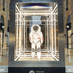 The spacesuit is in a glass box at the center of the turn of the century shopping arcade in Milan