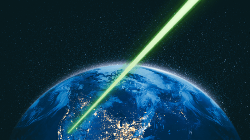 A laser beam hits earth from space, conveying a message to NASA from the Psyche spacecraft