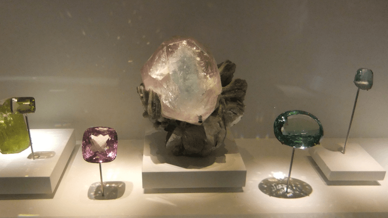 a selection of precious gemstones on display in a museum