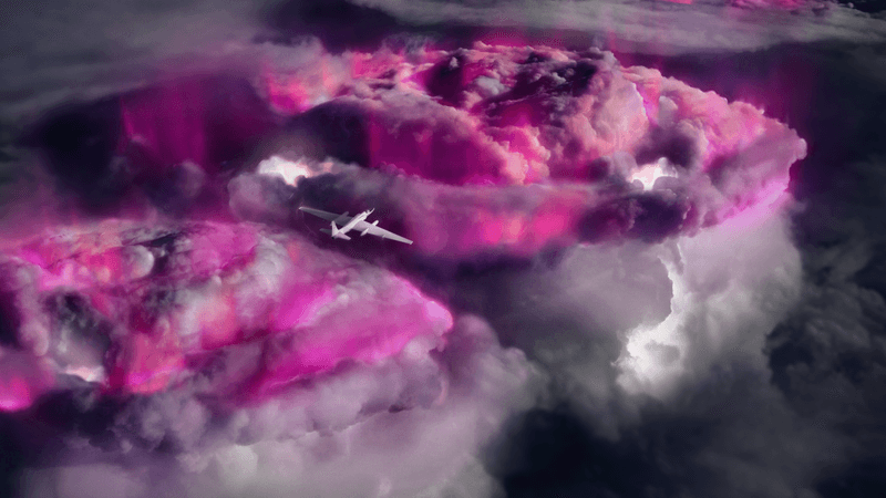 a plane is seen above the storm. the storm glows pink as a way to show where gamma-rays are coming from. 