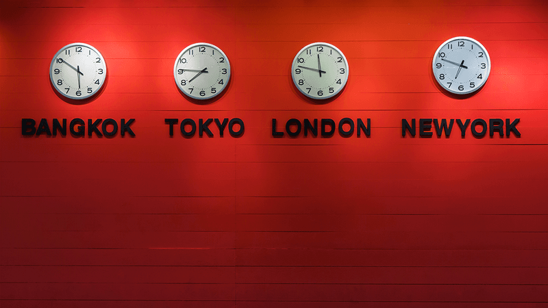 Four clocks, showing the time in different time zones.