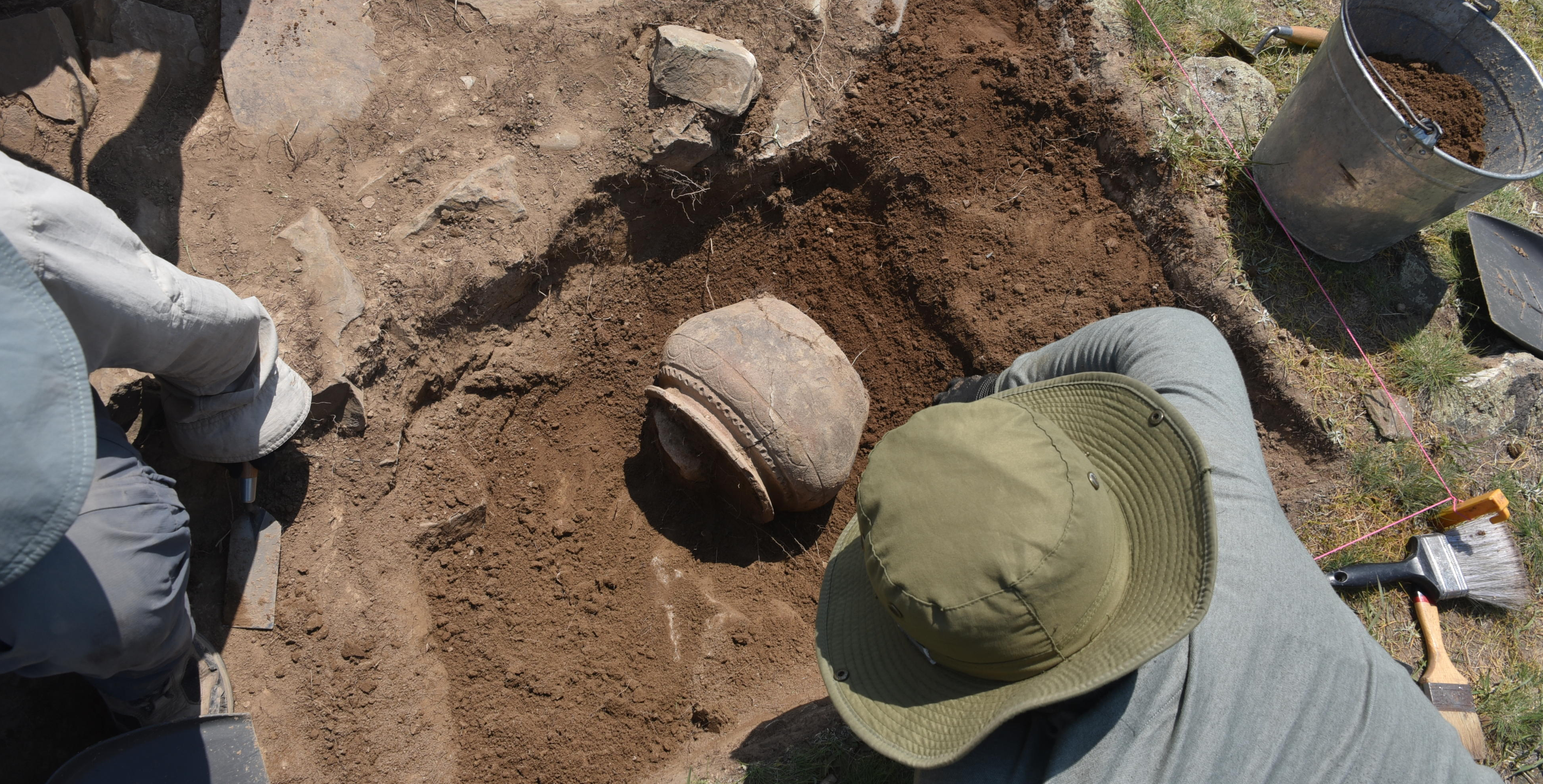 A preliminary dig at Tugunbulak in 2022 revealing pottery.