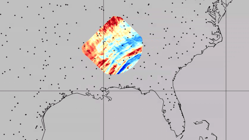 A map of the united states and on a small portion the data from the satellite. concetric bands of red and blue are visible