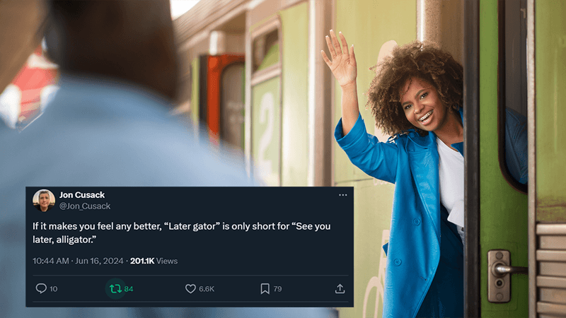 A woman waving goodbye as she gets on a train.