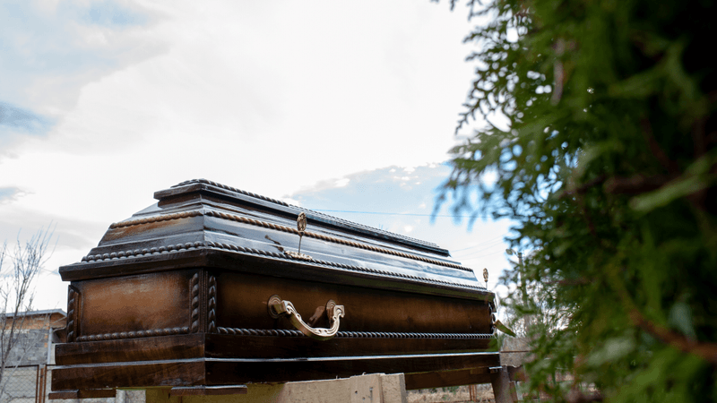 a coffin in a graveyard