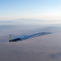 The experimental XB-1 plane flies over the Mojave Desert, California, USA.